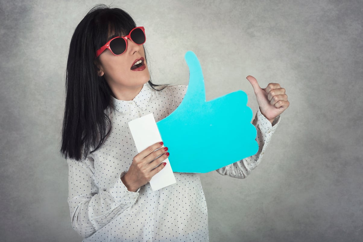 Young Woman Holding a like Icon